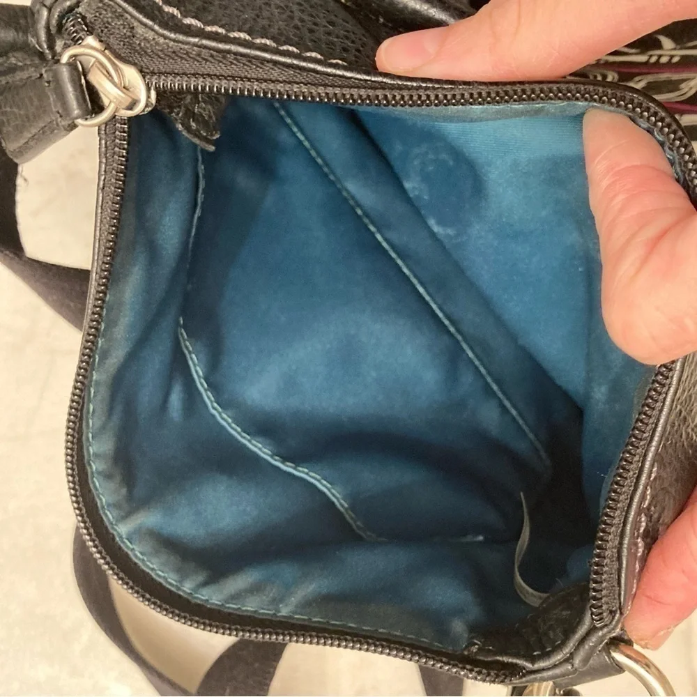 Coach black pebbled leather turnlock swingpack crossbody bag